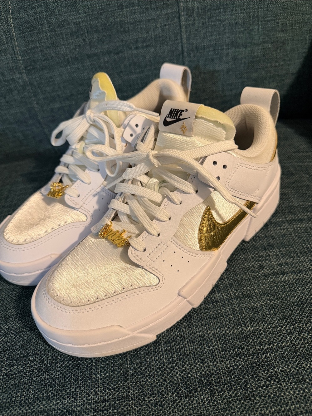 Nike Women’s White and Gold Low-Top Sneakers with Metallic Swoosh